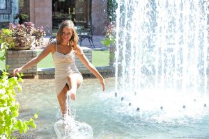 Riley plays in the fountain and naked in public